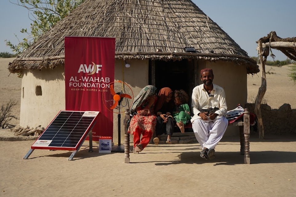 Ibrahim sitting near water pump